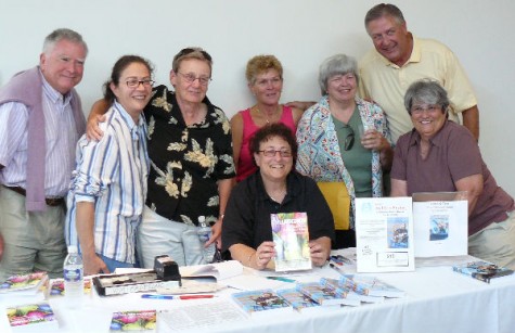 Some of the Porch People:  (L-R) Joe McMahon, Stefani Deoul, Mary Jane Wood, Fay Jacobs (seated), Lois Rayner, Betsy Schmidt, Kurt Rayner and Bonnie Quesenberry.