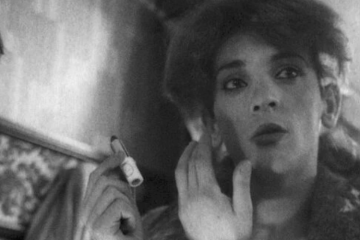 A femminielli does her makeup.